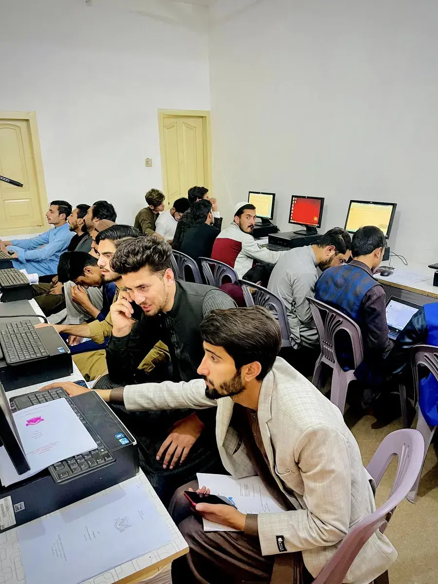 Portrait photograph of a practical computer lab training session at CBA